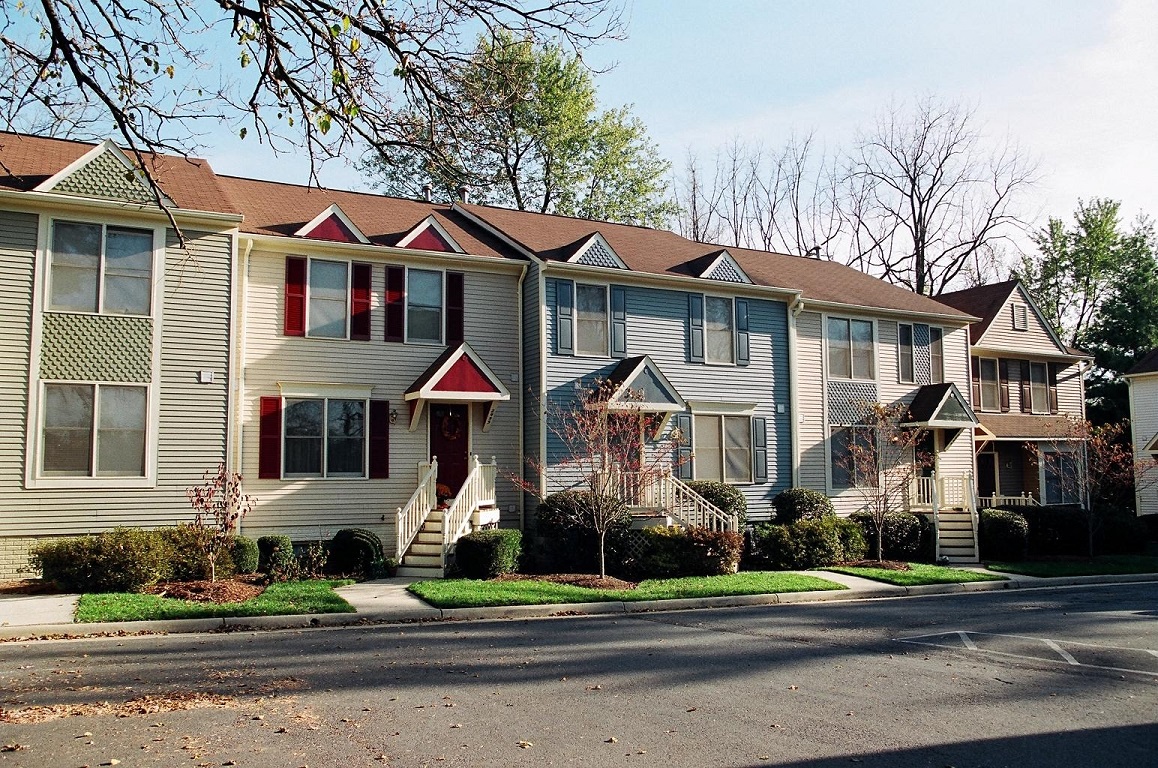 a row of houses on the side of a street